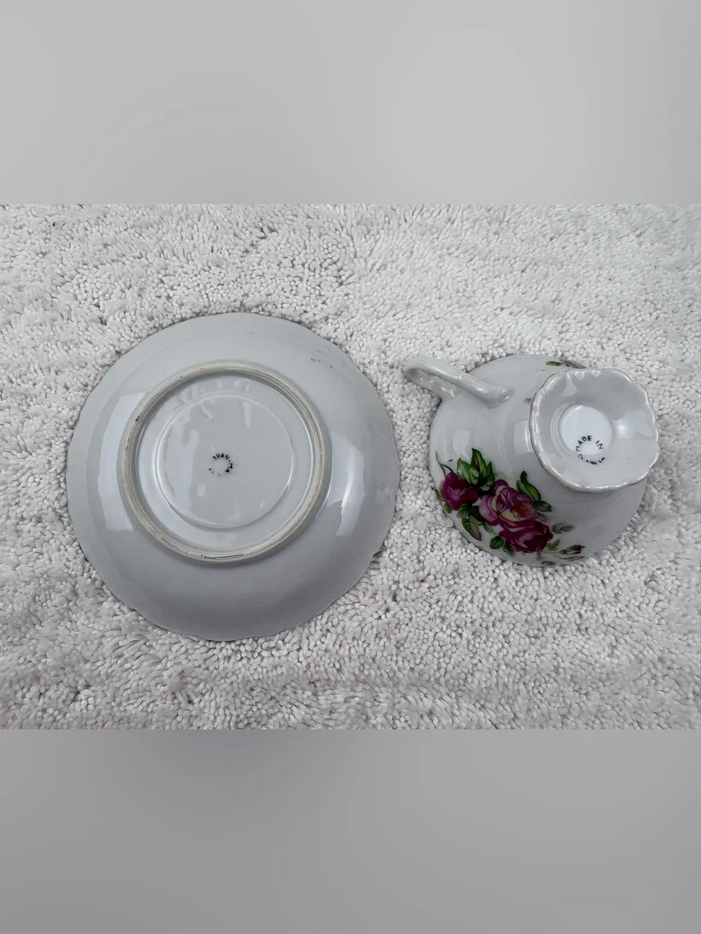 Vintage Porcelain Teacup & Saucer Set Featuring Pink Roses on a White Background